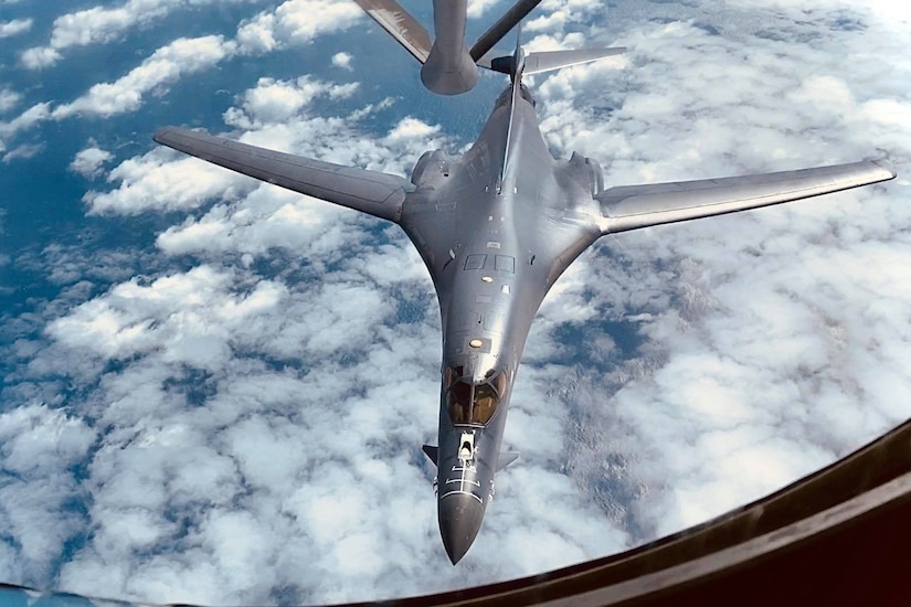 A jet is refueled in midair.