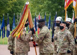 Command Sgt. Maj. Bernard P. Smalls Sr., outgoing senior enlisted advisor, 1st Theater Sustainment Command, conducts a change of responsibility as he passes the unit colors to Maj. Gen. John P. Sullivan, commanding general, 1st TSC, during a ceremony held at Fort Knox, Kentucky, July 28 2020. (U.S. Army photo by Spc. Zoran Raduka, 1st TSC, Public Affairs