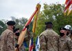 Maj. Gen. John P. Sullivan, commanding general, 1st Theater Sustainment Command, passes the unit colors to Command Sgt. Maj. Michael J. Perry III, incoming command sergeant major, 1st TSC, charging him with the responsibility as the unit’s new senior enlisted advisor during a ceremony held at Fort Knox, Kentucky, July 28 2020. (U.S. Army photo by Spc. Zoran Raduka, 1st TSC, Public Affairs)