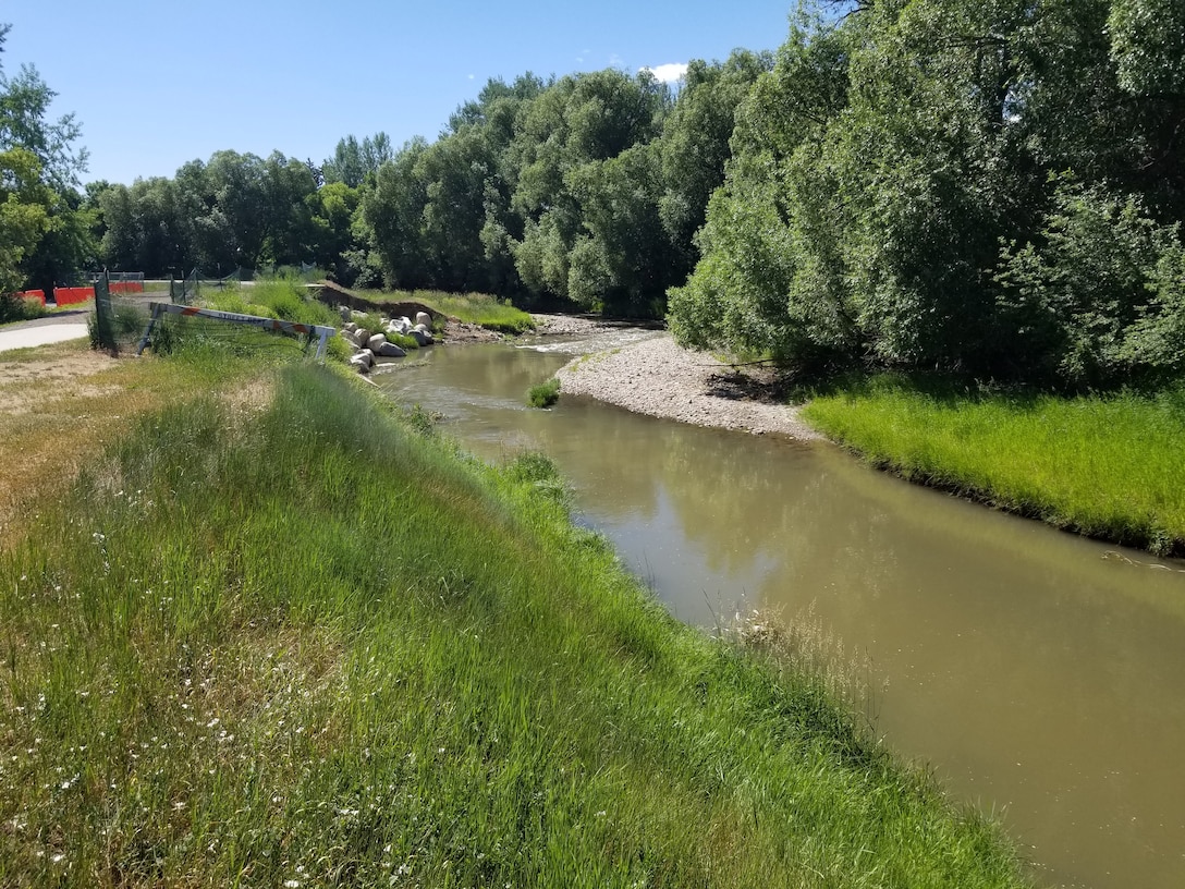 Damaged berm and slope that lead to levee crest road failure.