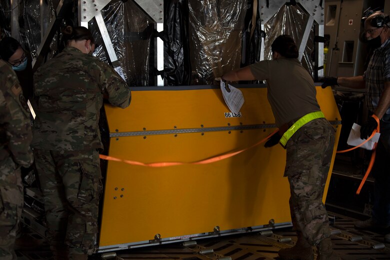 photos of a TIS unit and Airmen securing it to an aircraft