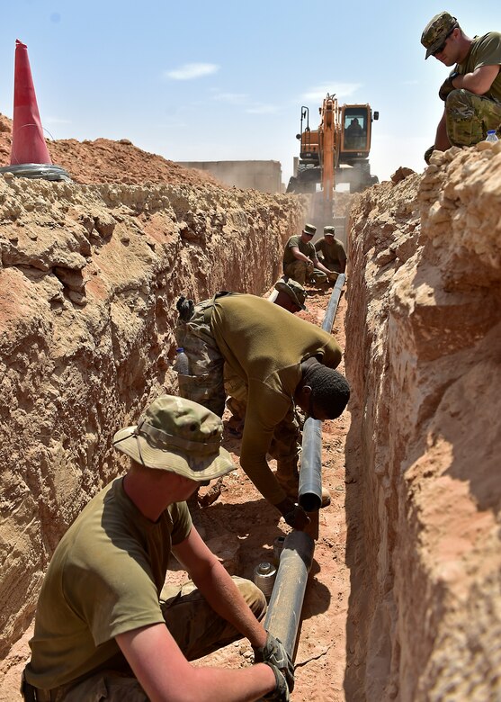 Airmen from the 378th Expeditionary Civil Engineer Squadron construct water and sewer lines at Prince Sultan Air Base, Kingdom of Saudi Arabia, July 28th, 2020.