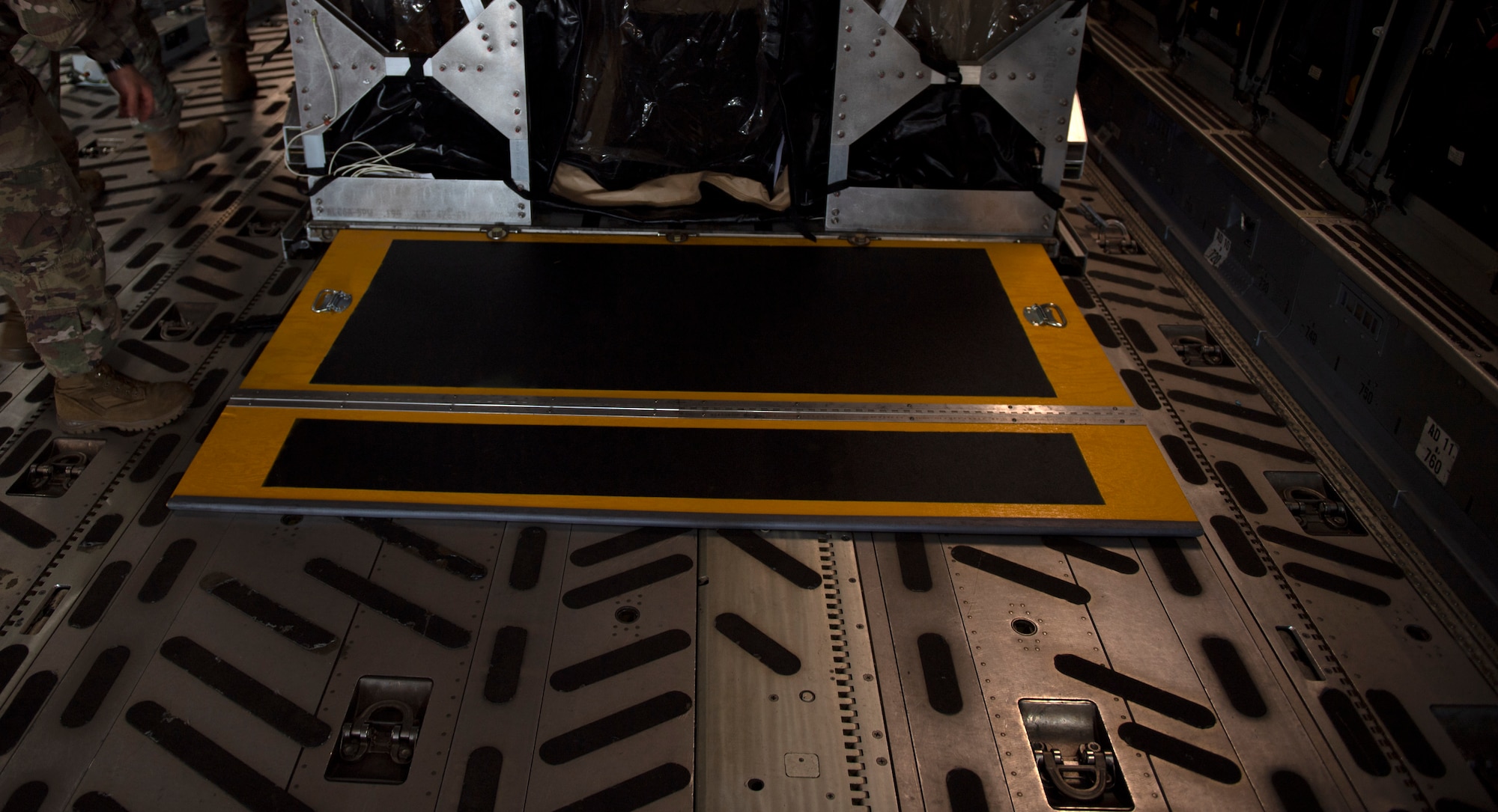 photos of a TIS unit and Airmen securing it to an aircraft
