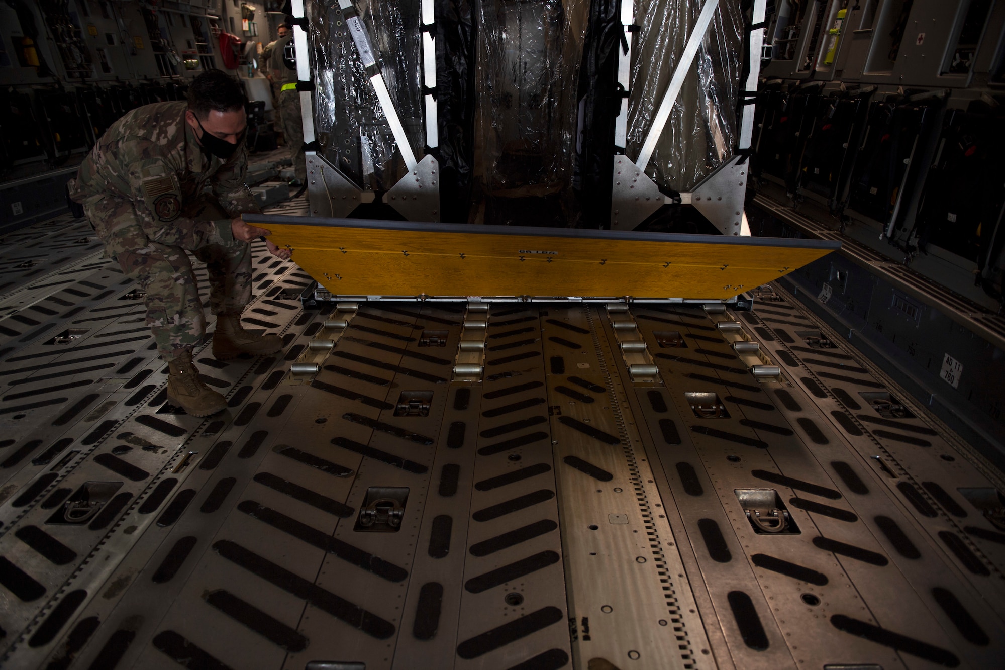 photos of a TIS unit and Airmen securing it to an aircraft