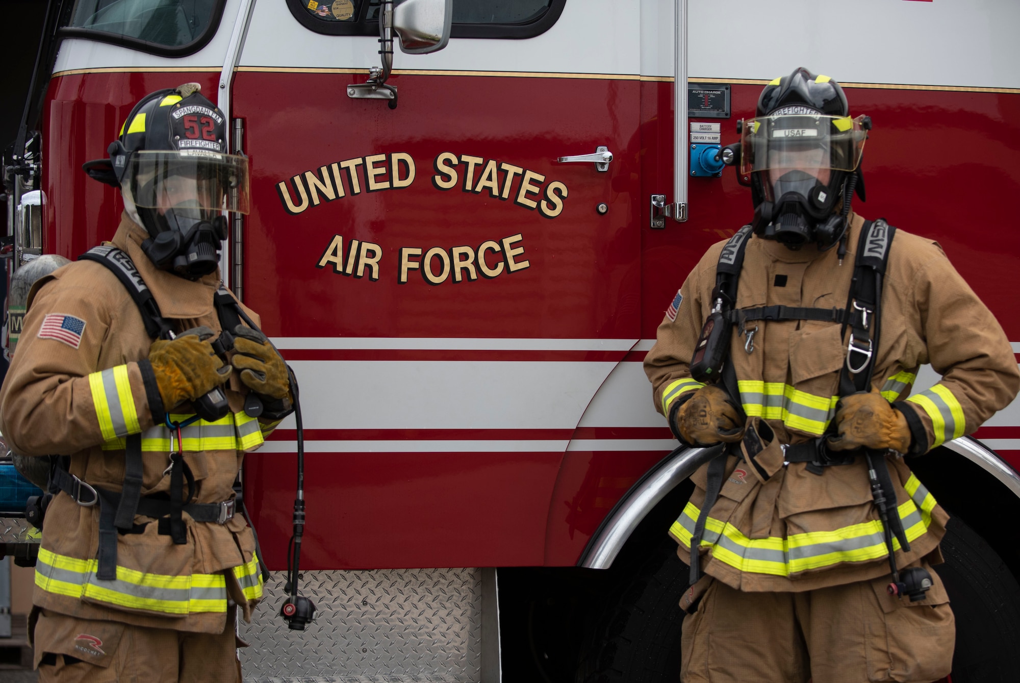 U.S. Air Force Senior Airman Brandon LaValla and Airman 1st Class Brandon Franklin, 52nd Civil Engineer Squadron Fire and Emergency Services firefighters, pose for a photo at Spandahlem Air Base, Germany, July 24, 2020. LaValla and Franklin demonstrated their capabilities by saving a victim from a distressed vehicle on their way home from training and ensured the safety of the victim and bystanders. (U.S. Air Force photo by Senior Airman Melody W. Howley)