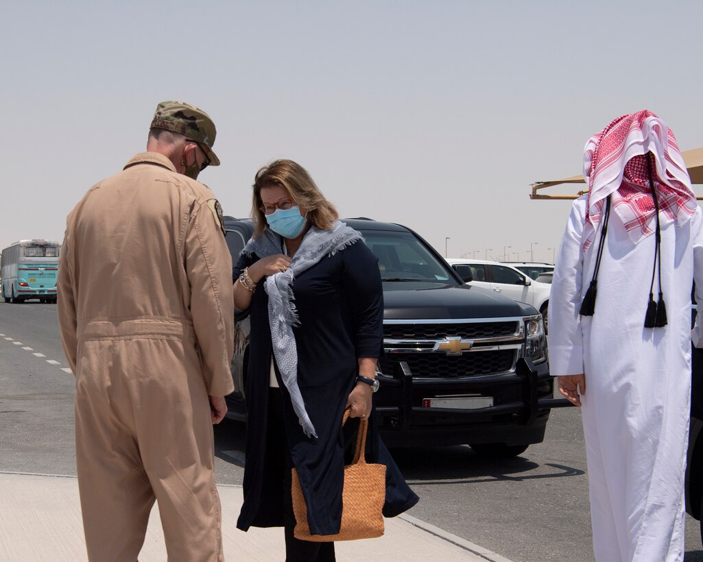 U.S. Air Force Lt. Gen. Gregory Guillot, U.S. Air Forces Central Command commander, greets U.S. Ambassador Greta Holtz, Chargè d’Affaires at the U.S. Embassy in Qatar, during her visit to the Combined Air Operations Center at Al Udeid Air Base, Qatar, July 30, 2020.