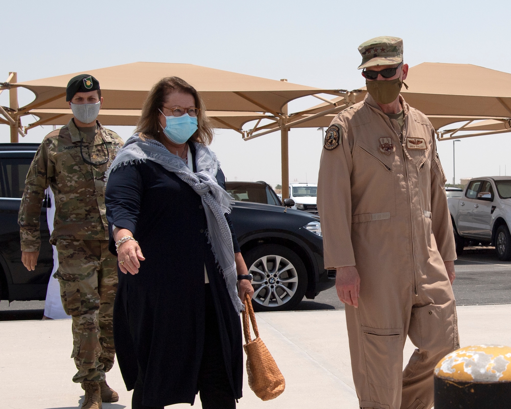 U.S. Air Force Lt. Gen. Gregory Guillot, U.S. Air Forces Central Command commander, greets U.S. Ambassador Greta Holtz, Chargè d’Affaires at the U.S. Embassy in Qatar, during her visit to the Combined Air Operations Center at Al Udeid Air Base, Qatar, July 30, 2020.