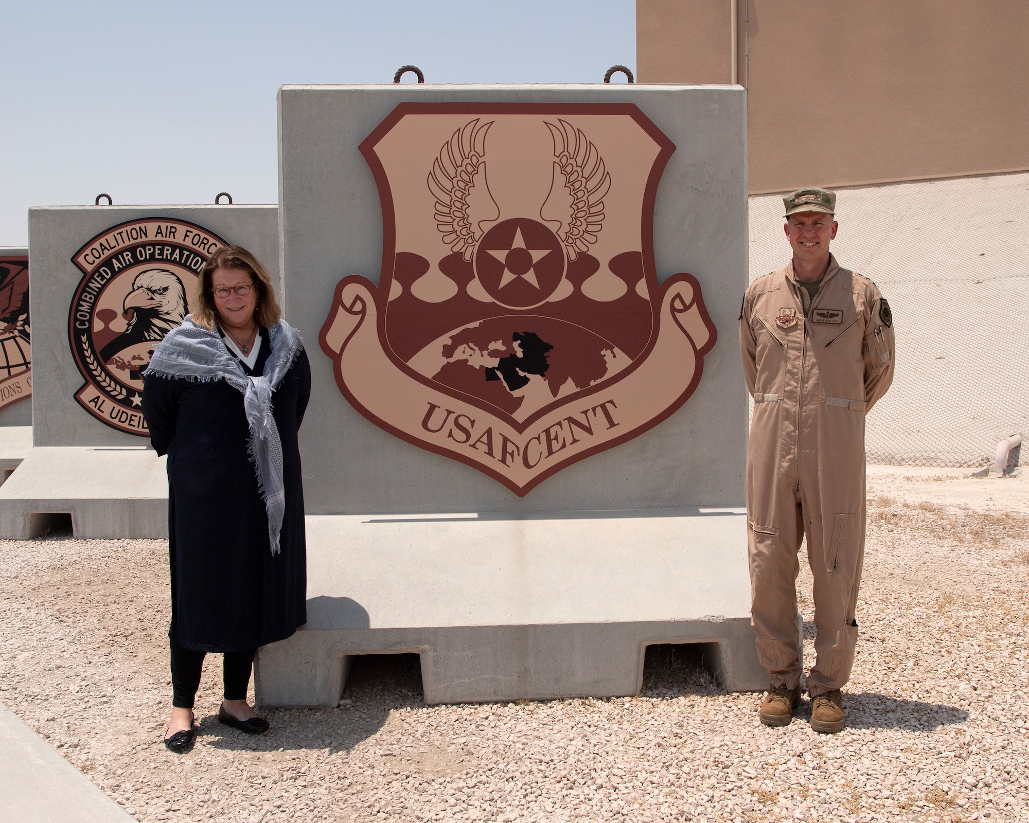 U.S. Air Force Lt. Gen. Gregory Guillot, U.S. Air Forces Central Command commander, greets U.S. Ambassador Greta Holtz, Chargè d’Affaires at the U.S. Embassy in Qatar, during her visit to the Combined Air Operations Center at Al Udeid Air Base, Qatar, July 30, 2020.