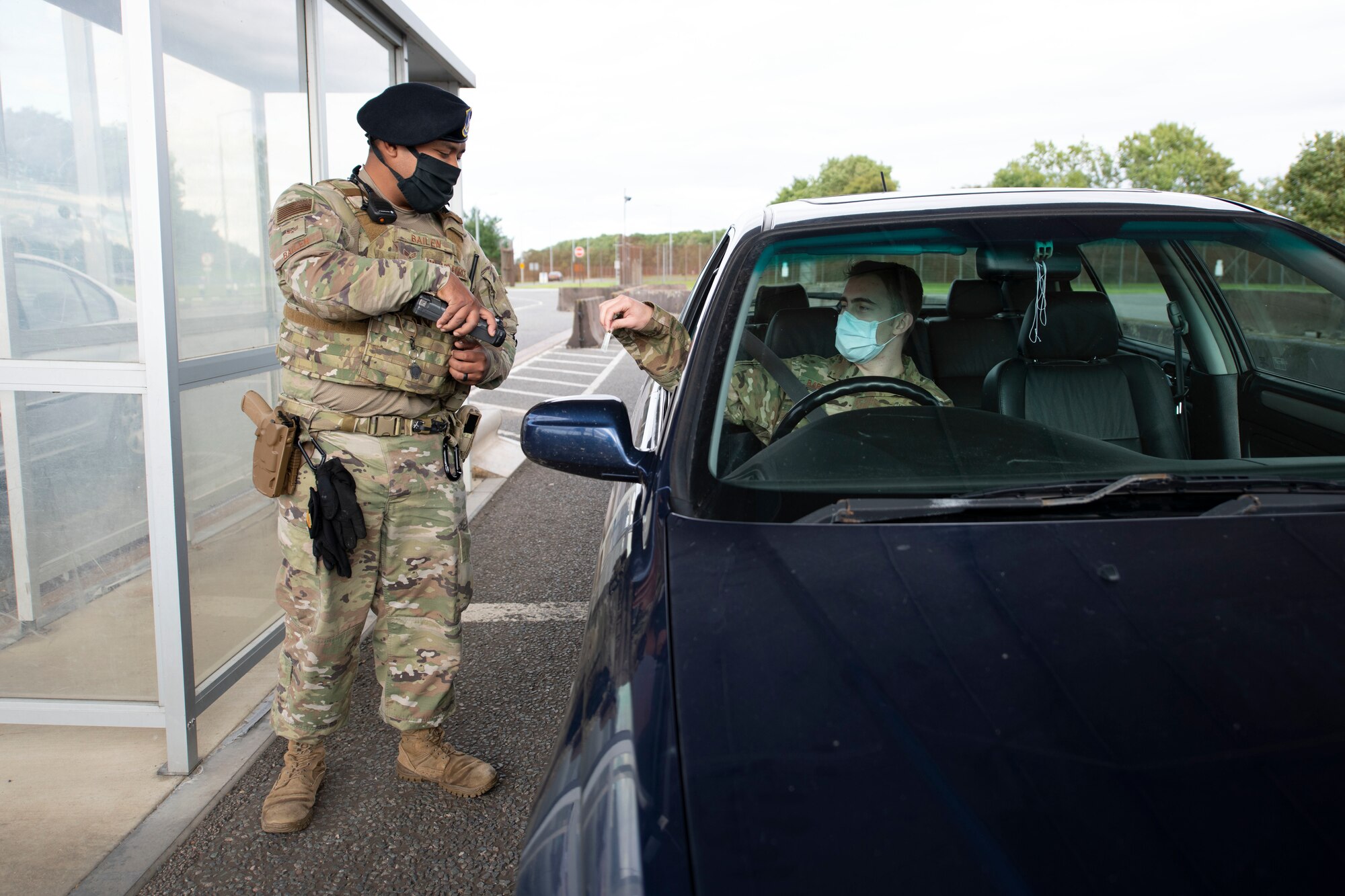U.S. Air Force Senior Airman Isaiah Bailen, 423rd Security Forces Squadron (SFS) patrolman, scans a common access card at entry gate during a simulated training at RAF Molesworth, England, July 28, 2020. 423rd SFS defenders conduct regular training and exercises to ensure mission readiness. (U.S. Air Force photo by Airman 1st Class Jennifer Zima)