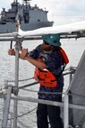 Dustin Spitler, Shop 89 mechanic, installs a scaffold on the vertical launch platform onboard Virginia class submarine, USS New Mexico (SSN 779).