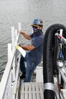 Collin Sawyer, Shop 38’s work leader, enters a cofferdam to perform retractable bow plan maintained. This is the first time FMB has installed the Retractable Bow Plane (RBP) cofferdam on a VA Class Submarine in Norfolk.
