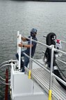 Collin Sawyer, Shop 38’s work leader, enters a cofferdam to perform retractable bow plan maintained. This is the first time FMB has installed the Retractable Bow Plane (RBP) cofferdam on a VA Class Submarine in Norfolk.