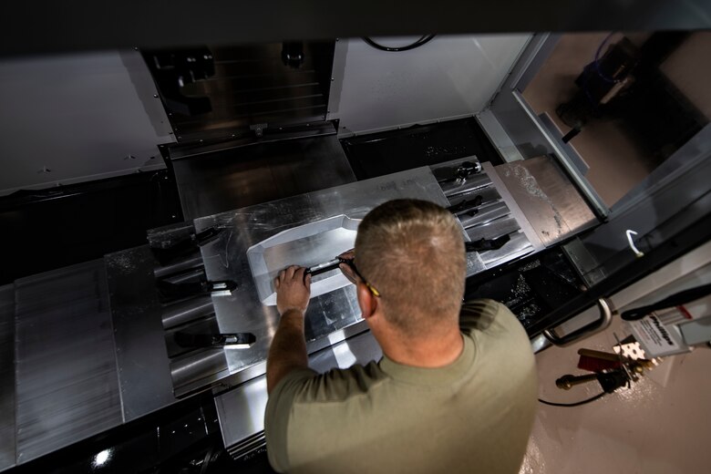 Staff Sgt. Adam Kitta, 911th Maintenance Squadron metals technology specialist, ensures a piece of metal is level before working on it at the Pittsburgh International Airport Air Reserve Station, Pennsylvania, July 8, 2020.
