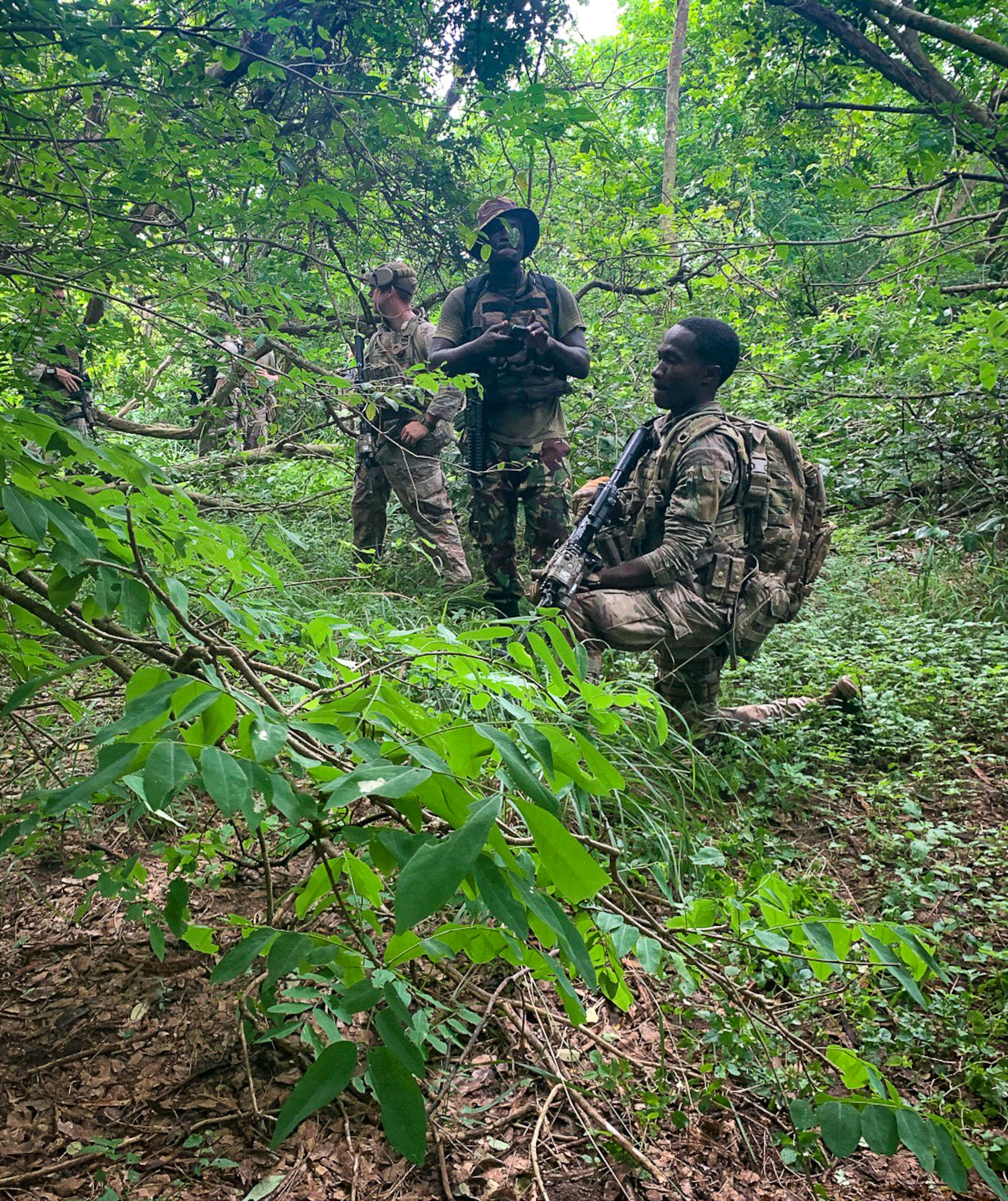Kenyan military forces practice patrolling and tactical skills with the 822nd Base Defense Squadron at Camp Simba Manda Bay, Kenya, June 18, 2020. The interoperability between the KMF and the 822d BDS helps improve tactical skills, and improve overall security for both forces.  (Courtesy photo)
