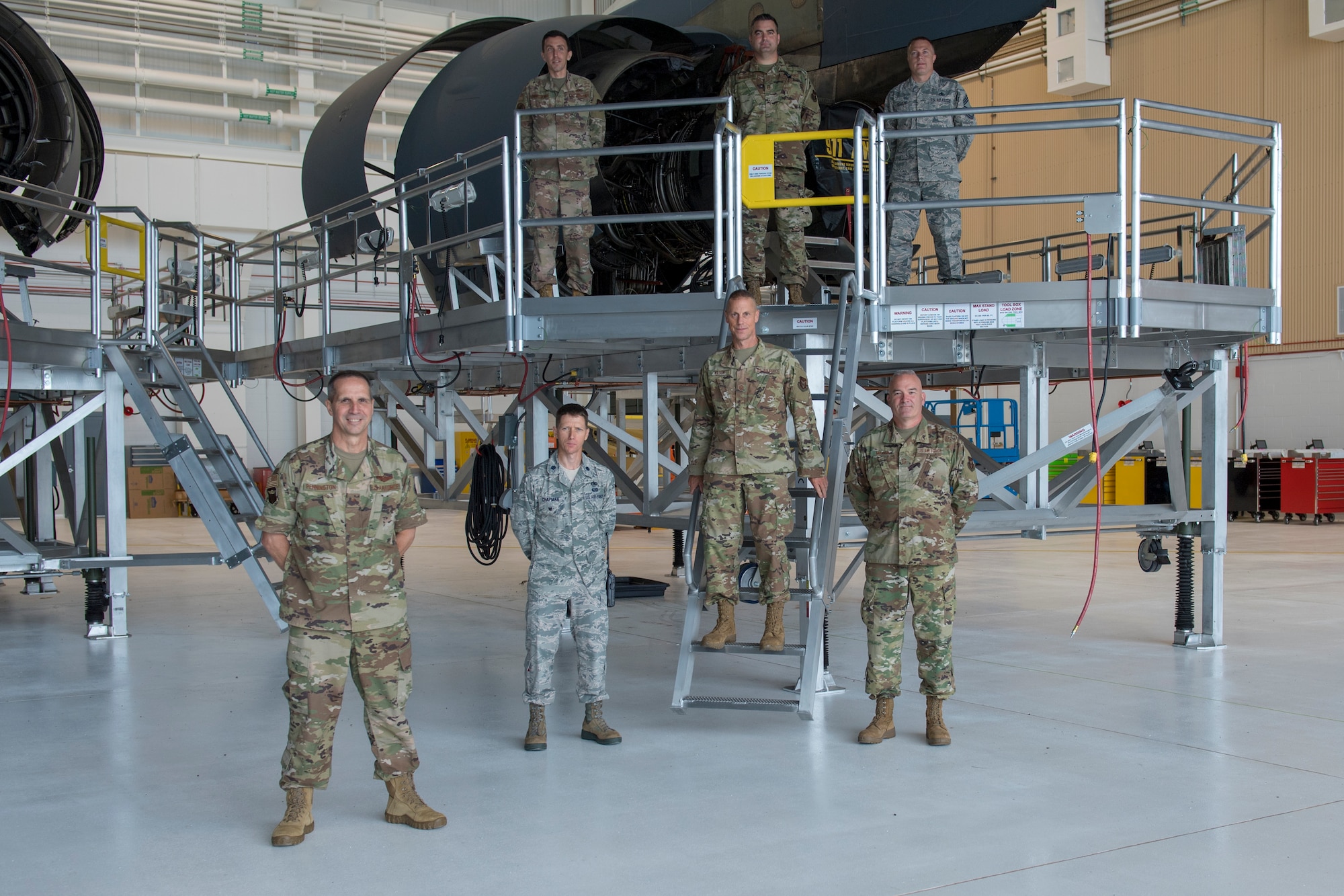 Brig. Gen. Jeffrey T. Pennington, commander of the 4th Air Force, poses for a group photo with members of the 911th Aircraft Maintenance Group at the Pittsburgh International Airport Air Reserve Station, Pennsylvania, July 11, 2020.