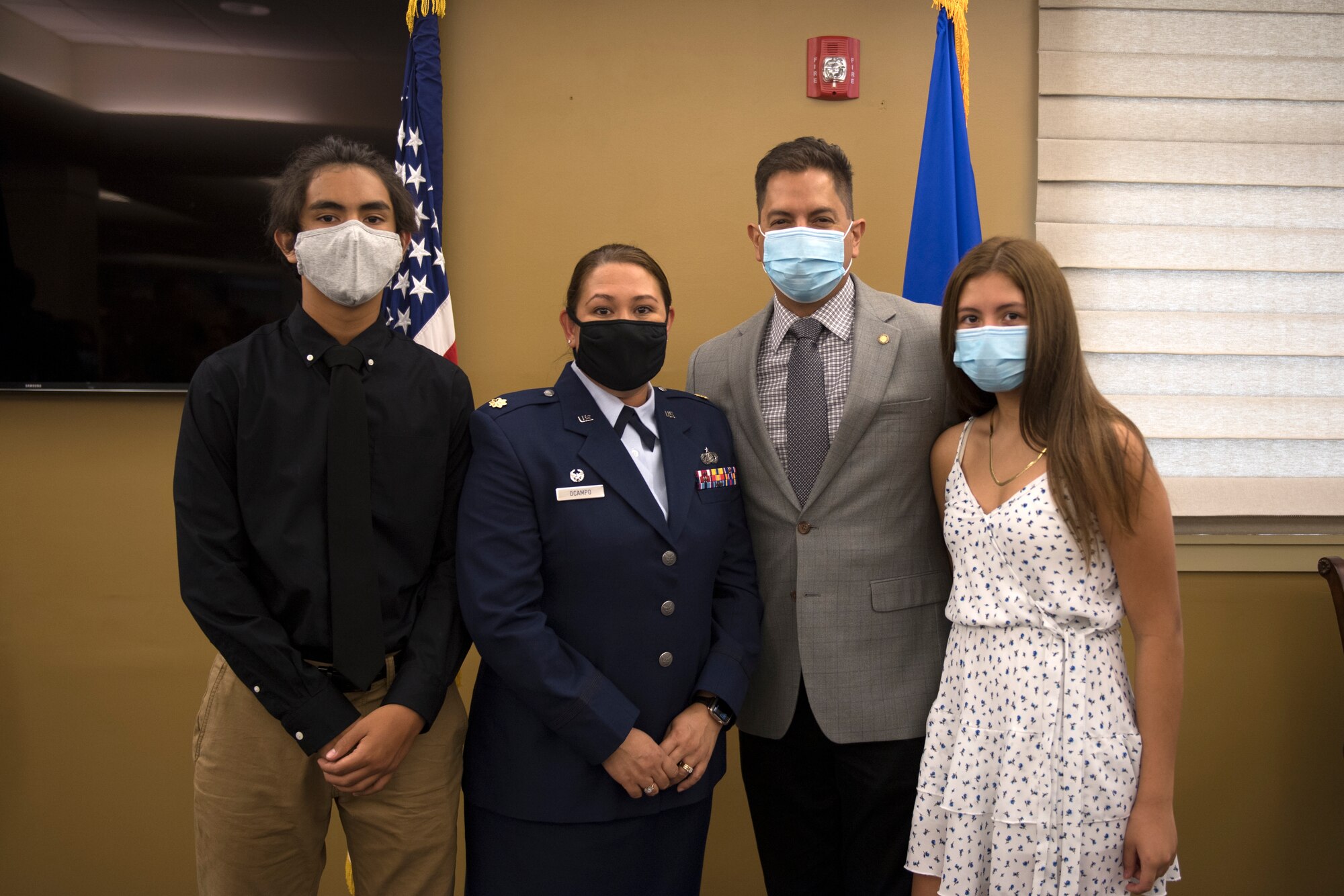 Maj. Sabrina Ocampo, commander of the 911th Force Support Squadron, poses with her family after her assumption of command ceremony at the Pittsburgh International Airport Air Reserve Station, Pennsylvania, July 12, 2020.