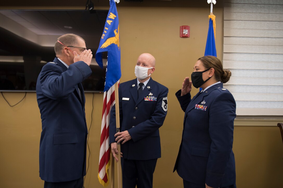 Maj. Sabrina Ocampo, commander of the 911th Force Support Squadron, salutes Col. Kenneth M. Lute, commander of the 911th Mission Support Group, during an assumption of command ceremony at the Pittsburgh International Airport Air Reserve Station. Pennsylvania, July 12, 2020.