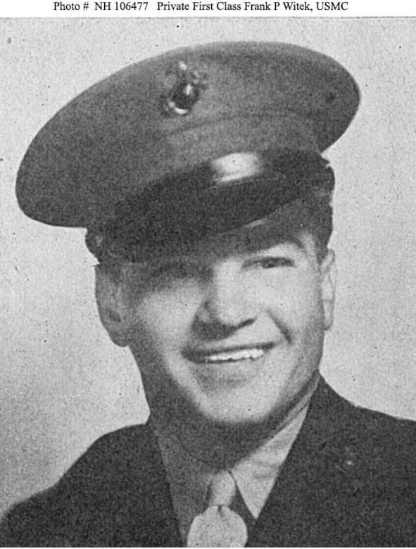 A Marine poses in his dress uniform.