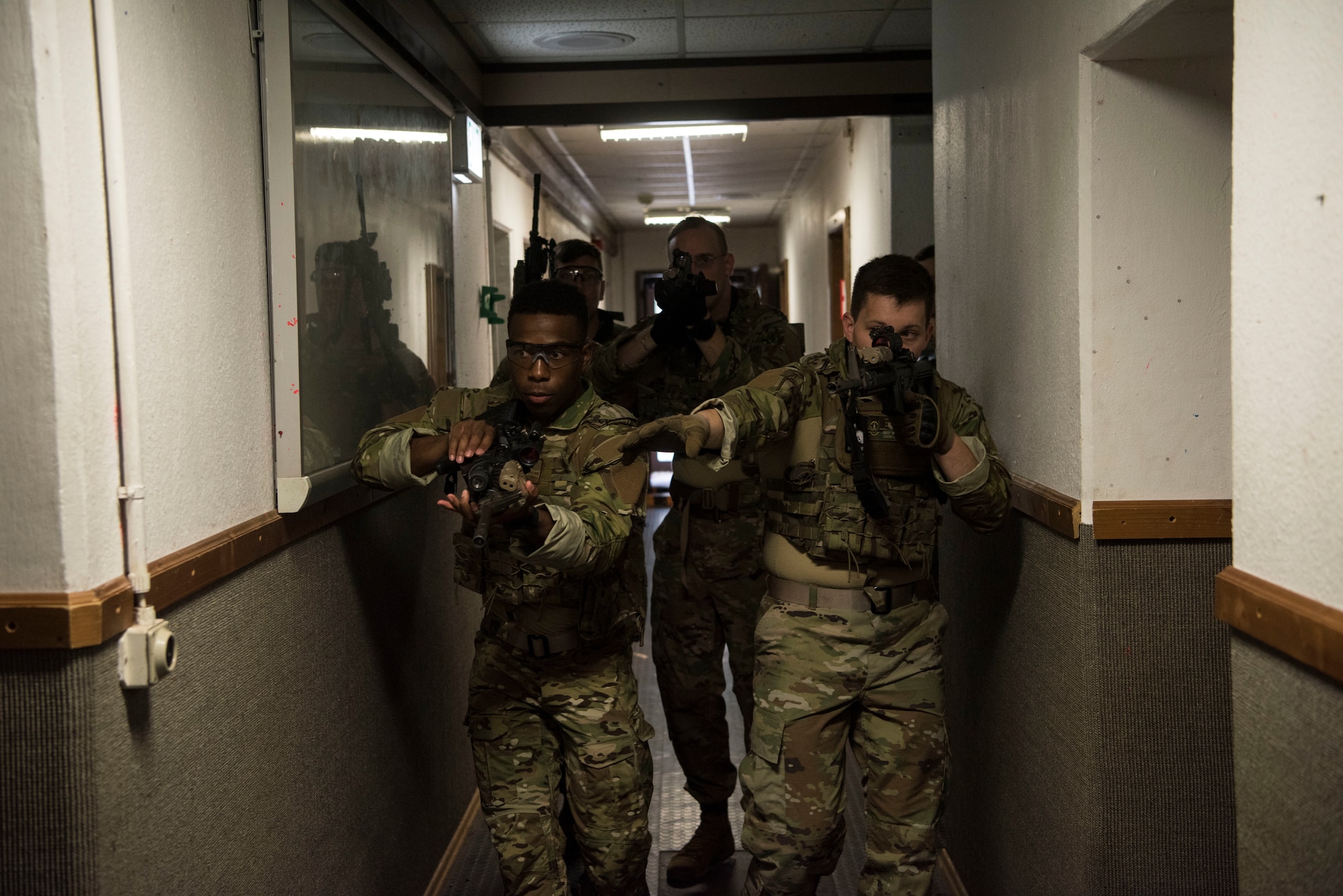 U.S. Air Force Airmen assigned to the 435th Security Forces Squadron practice building clearing techniques during close quarters battle training.