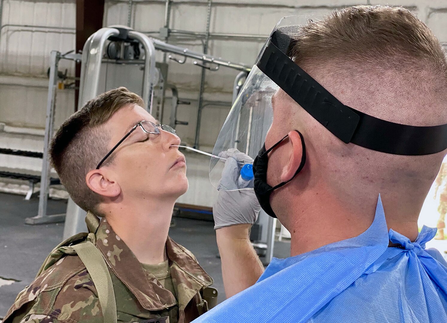 A soldier with the 28th Expeditionary Combat Aviation Brigade receives a test for COVID-19 at a mobilization station at Fort Hood, Texas, July 9, 2020.