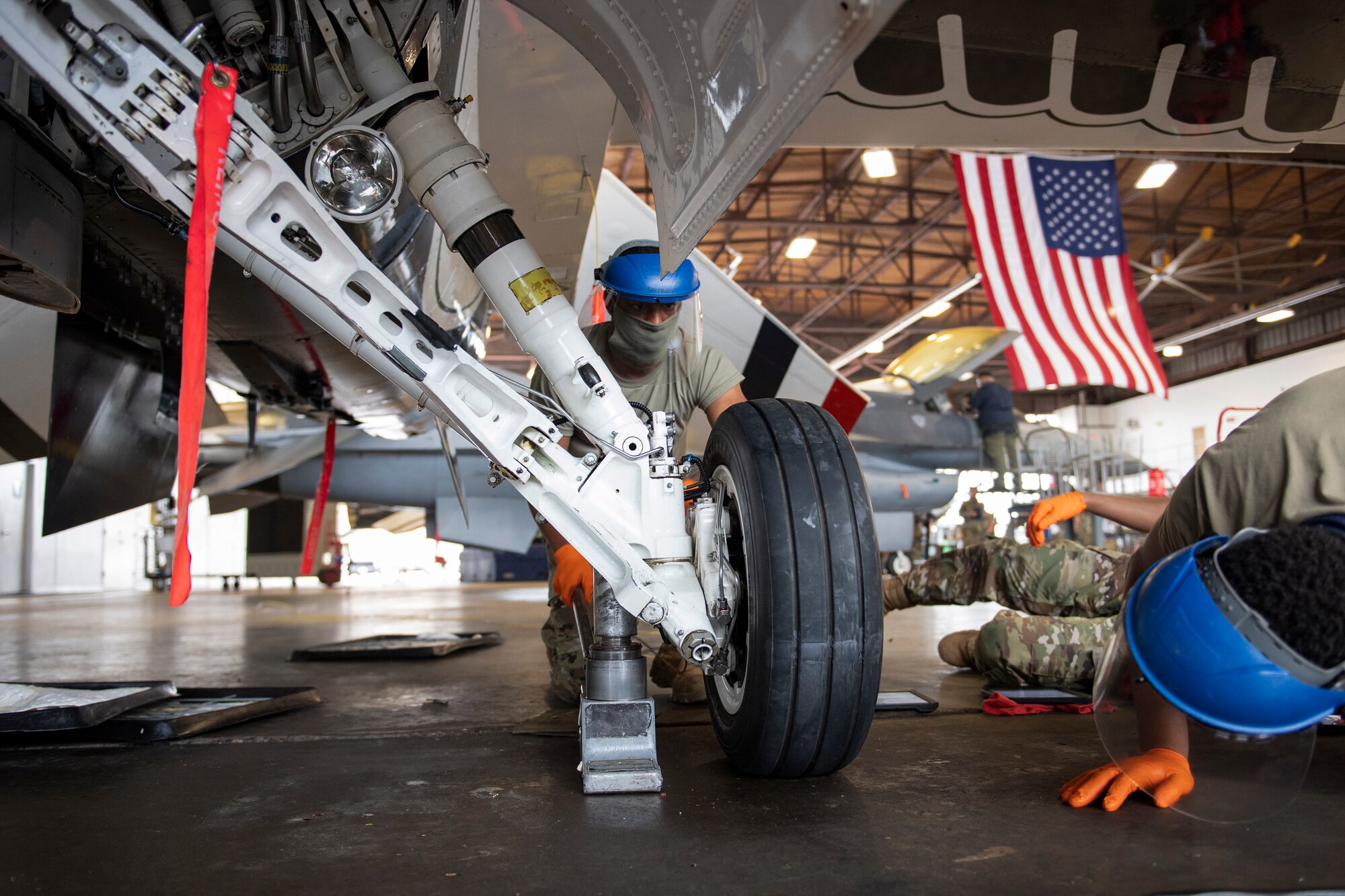 Airman services F-16 landing gear