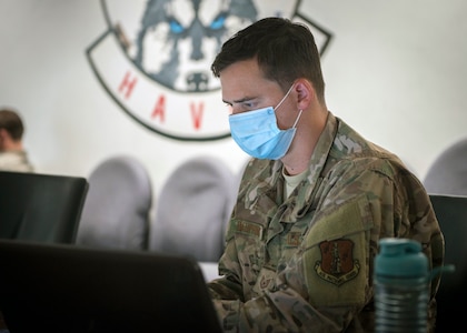 Tech. Sgt. Bryan Dauphinais, 103rd Communications Flight cyber transport journeyman, analyzes simulated cyberattacks during exercise Cyber Yankee at the Windsor Locks Readiness Center, Windsor Locks, Connecticut, July 30, 2020.