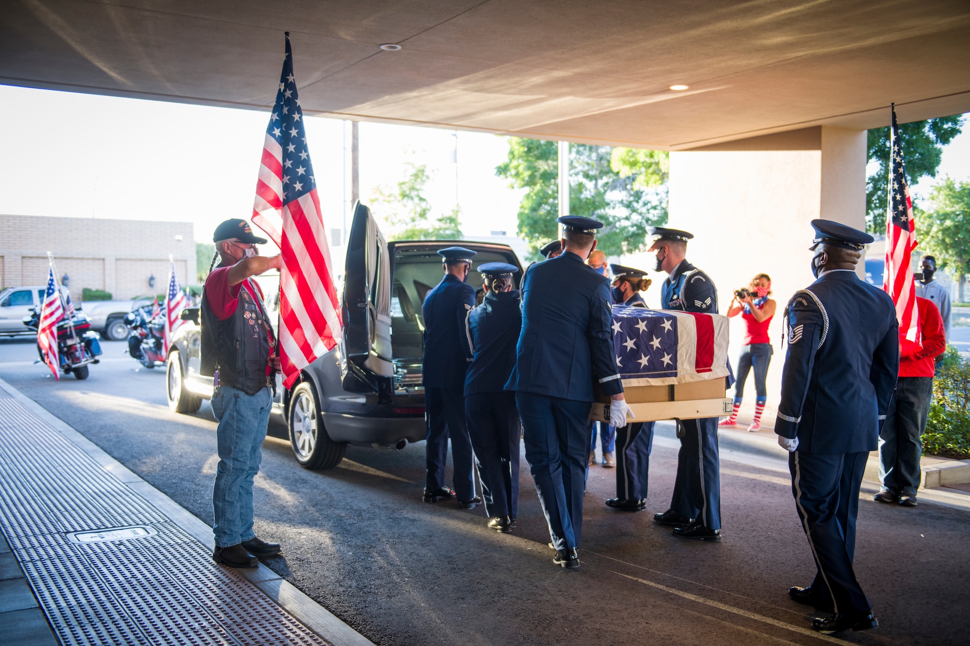 The 412th Test Wing’s Blue Eagles Honor Guard and local Patriot Guard Riders conduct a dignified transfer for Senior Airman Cody Chrisman in Lancaster, California, July 31. Chrisman passed away July 14 following a motor vehicle accident. Chrisman was assigned to the 412th Operations Support Squadron as an Aircrew Flight Equipment Journeyman. (Air Force photo by Giancarlo Casem)