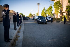 Members of the 412th Operations Support Squadron, 412th Test Wing, render salutes to Senior Airman Cody Chrisman in Lancaster, California, July 31. Chrisman passed away July 14 following a motor vehicle accident. Chrisman was assigned to the 412th Operations Support Squadron as an Aircrew Flight Equipment Journeyman. (Air Force photo by Giancarlo Casem)