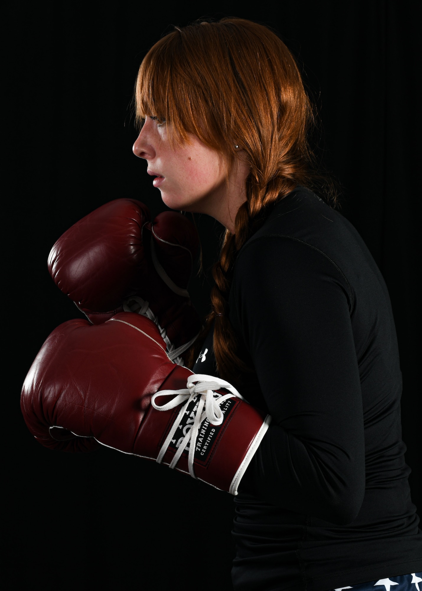 Senior Airman Sarah Jane Gruber, a broadcast journalist for the 910th Public Affairs Office, poses for a photo in her boxing attire, July 11, 2020, Youngstown Air Reserve Station. Gruber competes in Women’s Amateur Boxing for USA Boxing’s Great Lakes Region and has trained in boxing for four years.