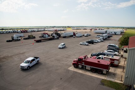 Federal Emergency Management Agency and Defense Logistics Agency in-process trucks containing Hurricane Harvey disaster relief supplies August 30, 2017, at Joint Base San Antonio-Sequin Auxiliary Air Field, Texas. JBSA units are supporting DLA and the FEMA in the disaster relief efforts after Hurricane Harvey.