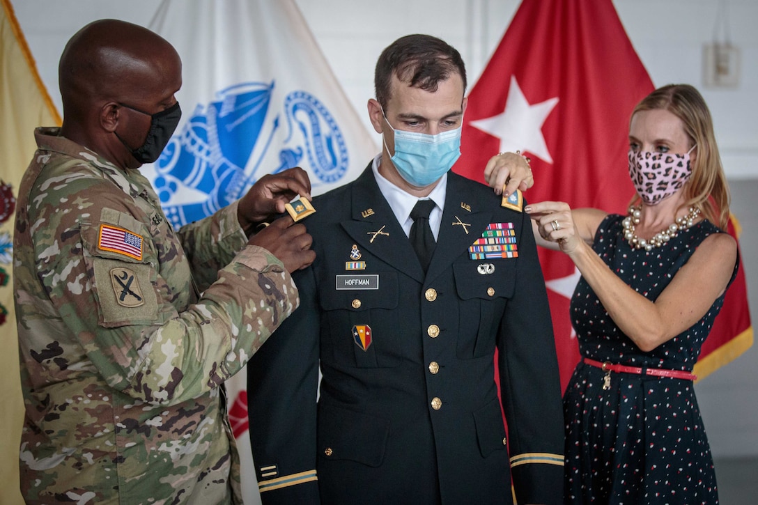 A soldier gets pinned by another soldier and his wife.