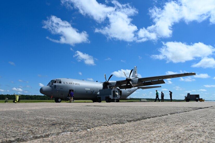 An aircraft sits on a runway.