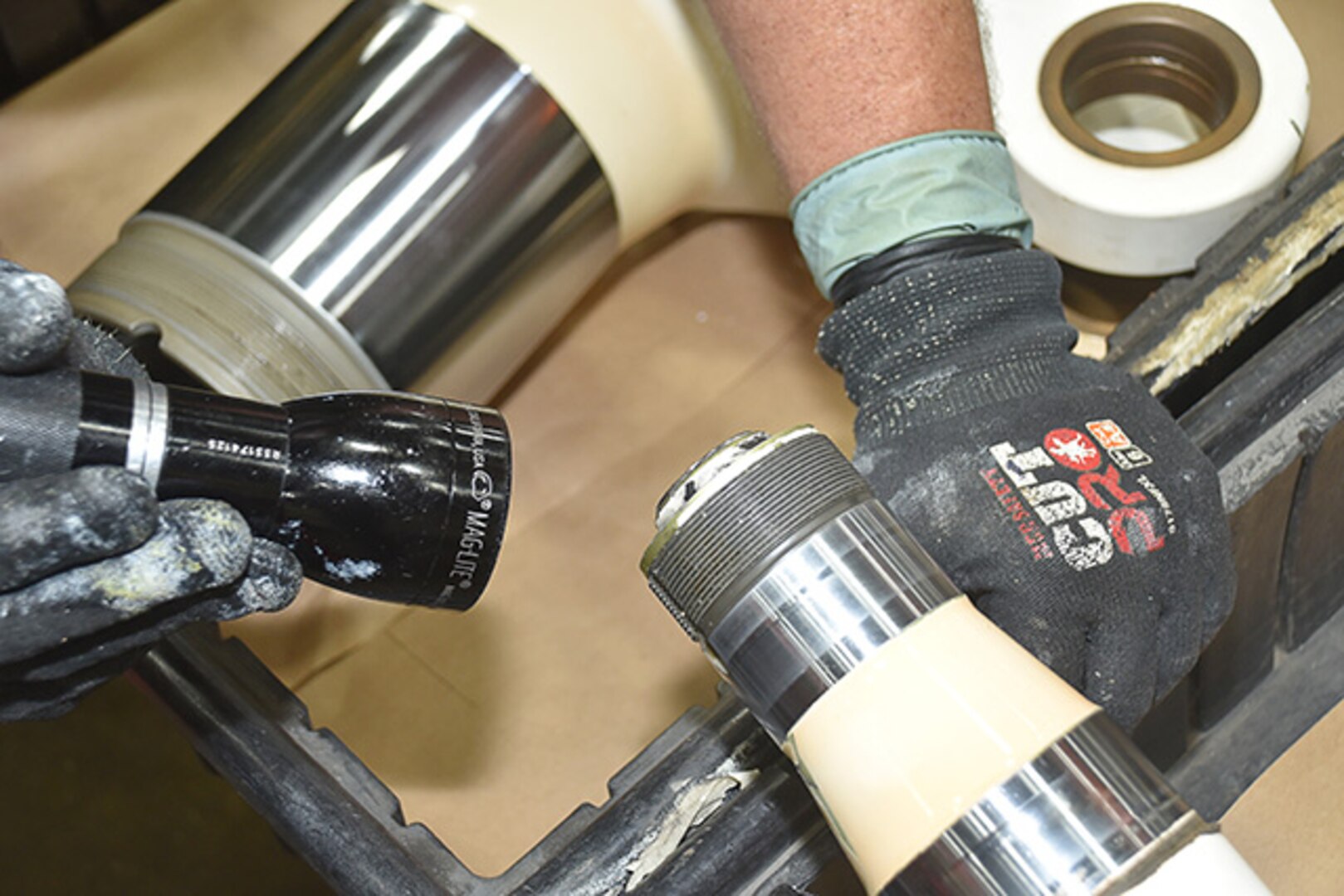 mechanic inspects landing gear