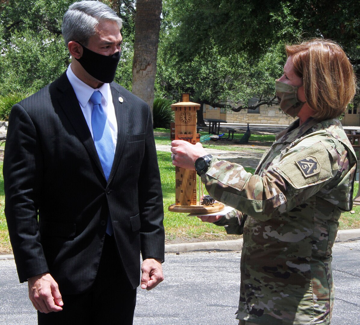 Lt. Gen. Laura J. Richardson (right), commanding general of U.S. Army North (Fifth Army) and the Joint Force Land Component Command, presents San Antonio Mayor Ron Nirenberg with a replica of the historic Fort Sam Houston Quadrangle during his visit to Fort Sam Houston July 29. U.S. Army North leaders were able to update City of San Antonio officials on their day-to-day mission, as well as the response against the COVID-19 pandemic, which includes hospitals across San Antonio.