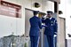 U.S. Air Force Senior Airmen Javier Barraza and Michael McCaskill, 354th Force Support Squadron ceremonial guardsman, prepare to give a folded flag during a ceremony on Eielson Air Force Base, Alaska, July 31, 2020. The ceremony was held before the 6th Annual Explosive Ordnance Disposal (EOD) Memorial Arctic Ruck to honor 32 EOD Airmen who have died in the line of duty. (U.S. Air Force photo by Senior Airman Beaux Hebert)