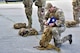 U.S. Air Force Staff Sgt. Anthony Vega, the 354th Civil Engineer Squadron Explosive Ordnance Disposal (EOD) flight noncommissioned officer in charge of operations, puts a folded flag into his rucksack on Eielson Air Force Base, Alaska, July 31, 2020. Vega and his team will carry the flag 220 miles from Eielson AFB to the Arctic Circle in honor of 32 EOD Airmen who died in the line of duty. (U.S. Air Force photo by Senior Airman Beaux Hebert)