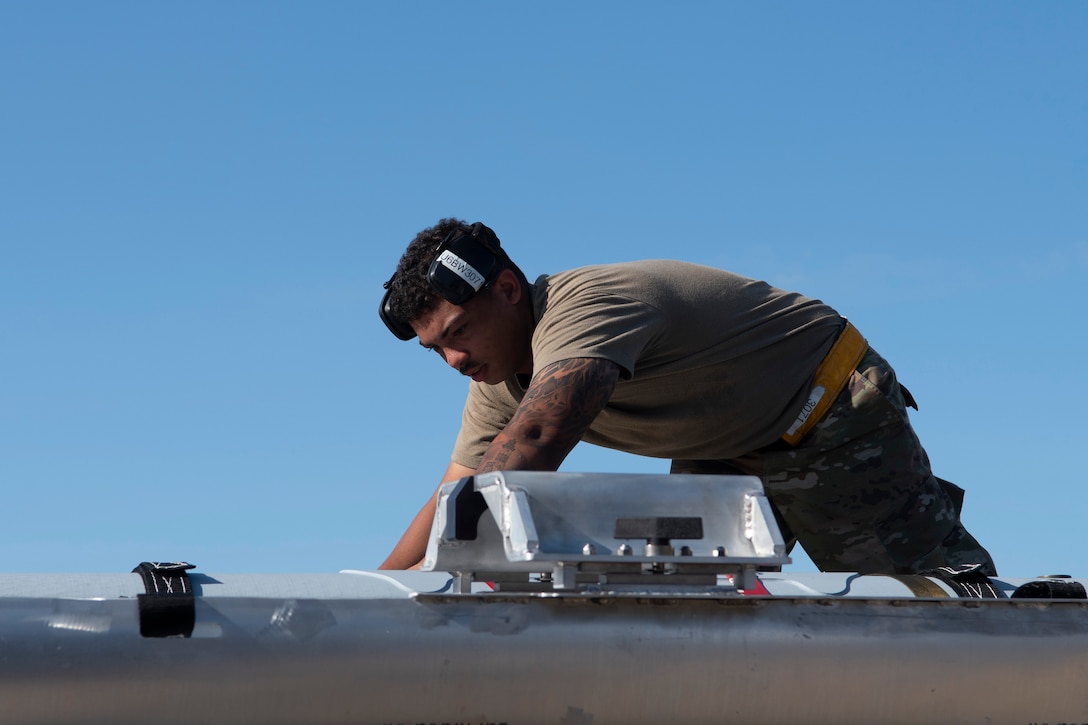 Photo of Airman working on flightline.