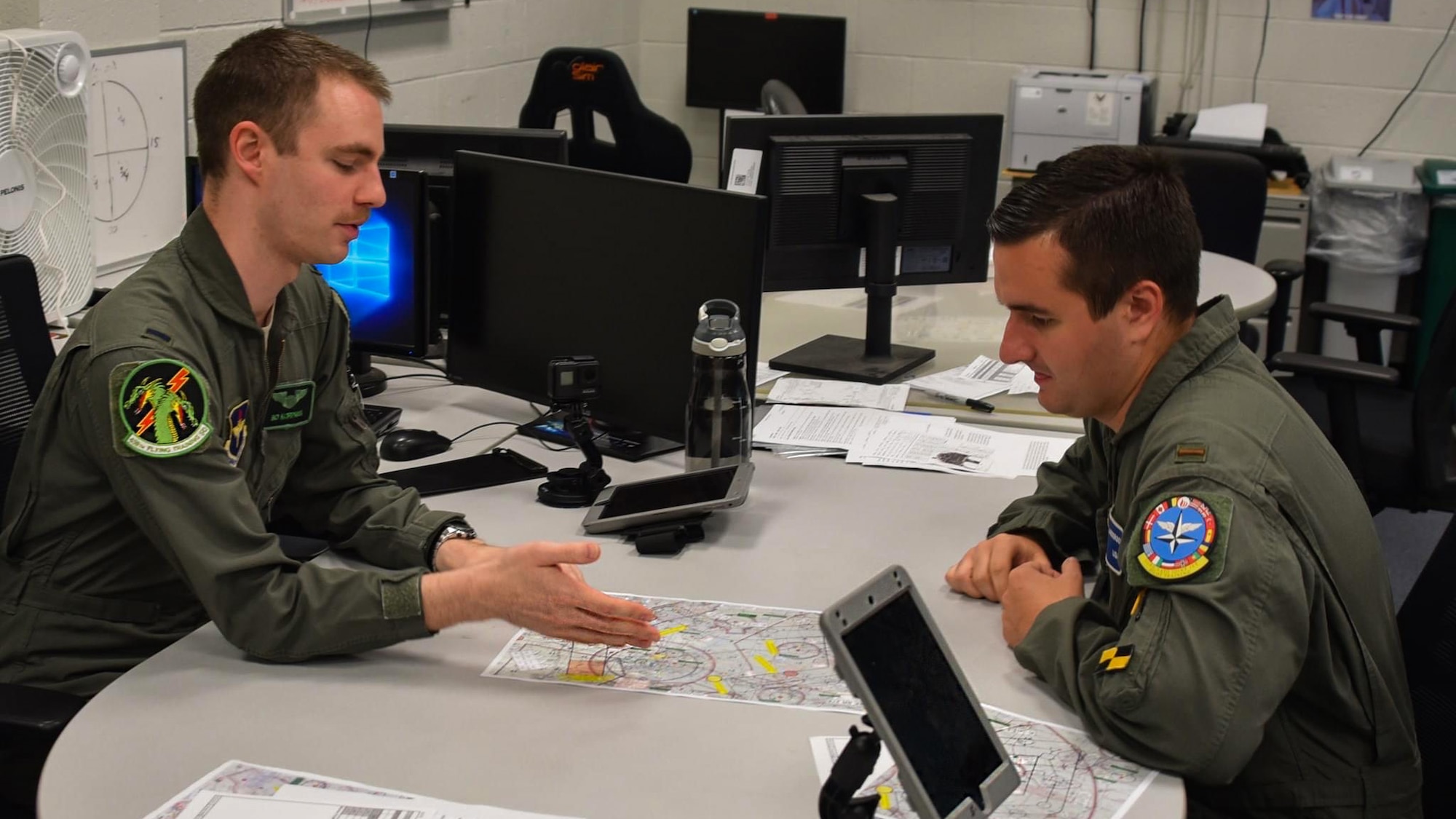 Instructor pilot briefs student
