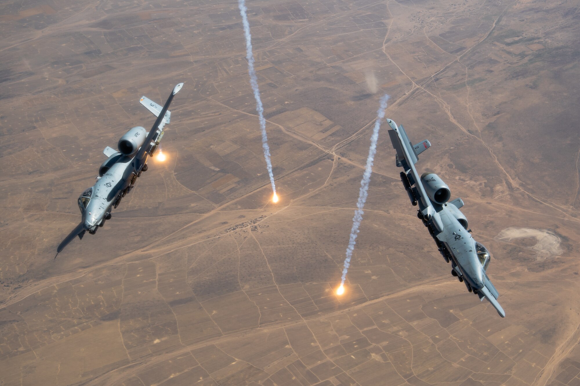 A U.S. Air Force KC-135 Stratotanker refuels A-10 Thunderbolts.