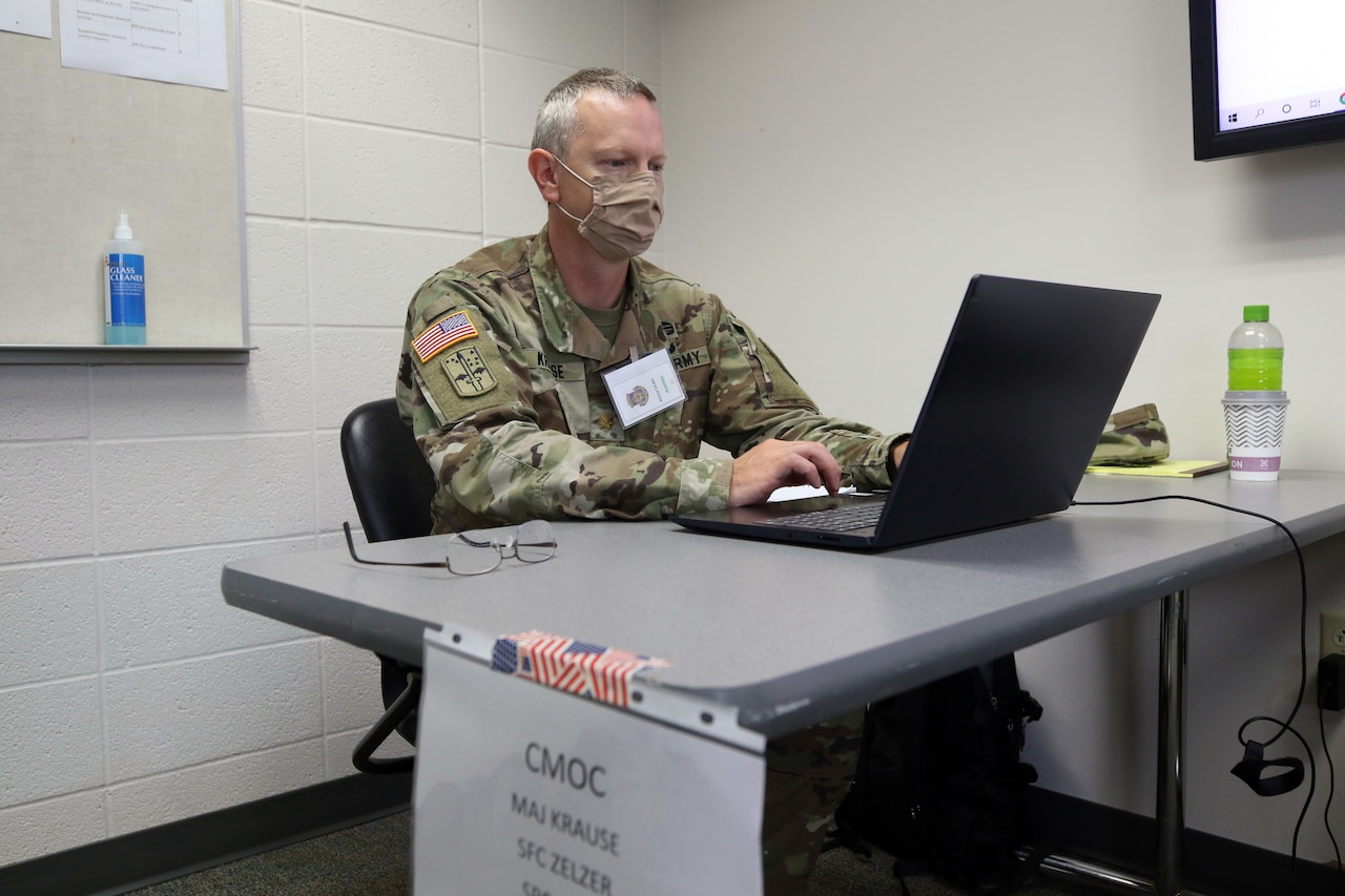 A soldier reviews information during a training exercise.