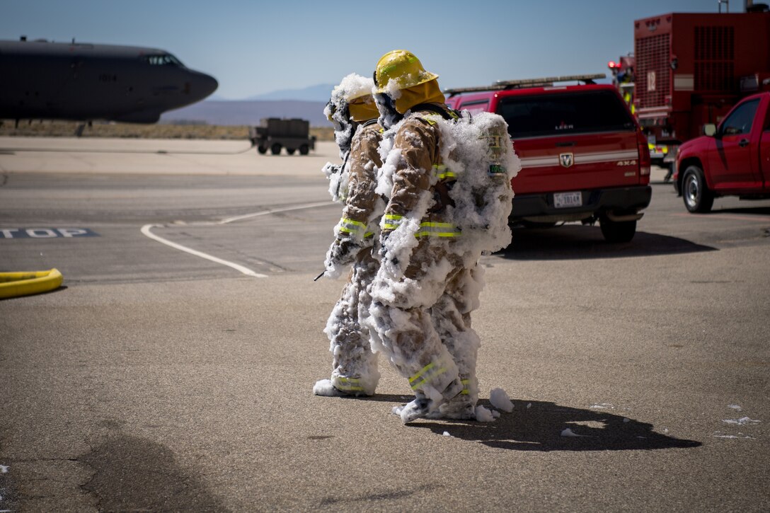 Firefighters from the Edwards Air Force Base Fire and Emergency Services conduct search and rescue training at recently remodeled hangar at Edwards Air Force Base, California, July 23. The unique training opportunity provided the firefighters a mentally and physically demanding training scenario. (Air Force photo by Chris Dyer)