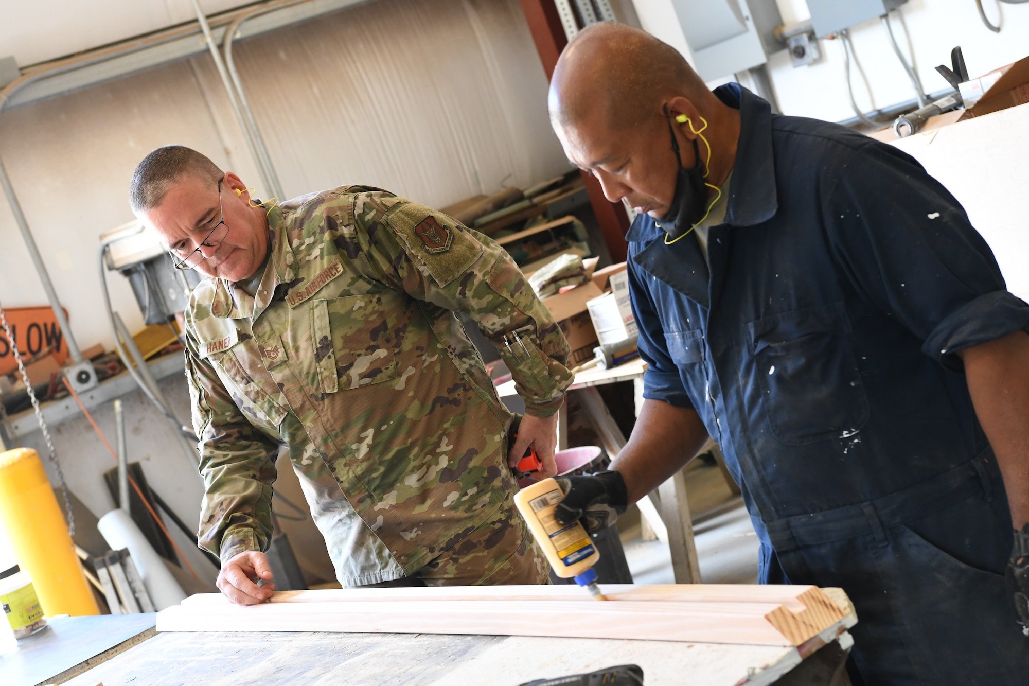 A photo of U.S. Air Force Tech. Sgt. Jason Haner and Tech Sgt Adonico Balingnasay, 624th Civil Engineer Squadron, preparing molding for facility repairs at Bellows Air Force Station, Hawaii, July 22, 2020, during the unit’s Annual Training. The U.S. Air Force Reserve’s 624th CES provided necessary repairs at Bellows AFS, a Military Welfare and Recreation facility that supports military families and communities, to improve infrastructure and increase individual readiness skills. (U.S. Air Force photo by Tech. Sgt. Garrett Cole)