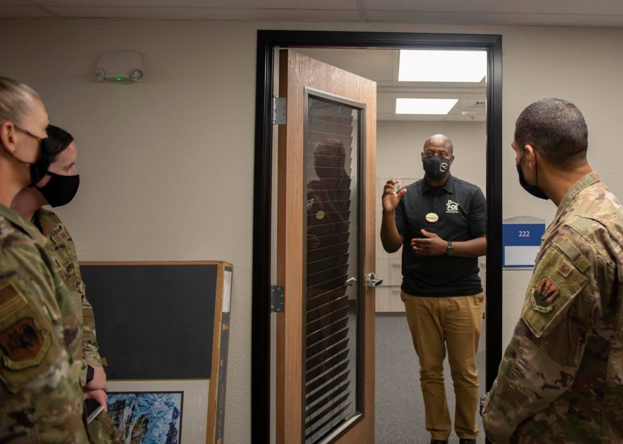 Col. Jason Bell, 432nd Wing/432nd Air Expeditionary Wing vice commander, right, and Col. Dina Quanico, left, 432nd Mission Support Group commander, tour the newly renovated consolidated support center at Creech Air Force Base.