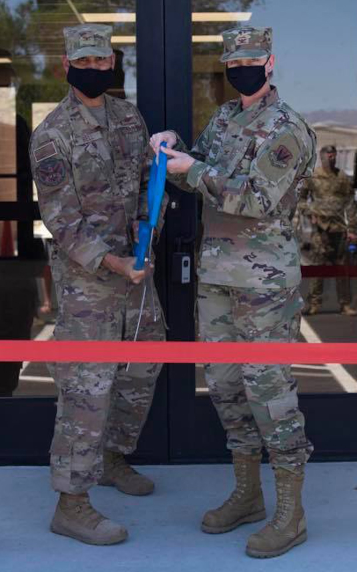 Col. Jason Bell, 432nd Wing/432nd Air Expeditionary Wing vice commander, and Col. Dina Quanico, 432nd Mission Support Group commander, cut the ribbon for the grand opening of the 432nd Support Squadron’s consolidated support center at Creech Air Force Base, Nevada, July 28, 2020.