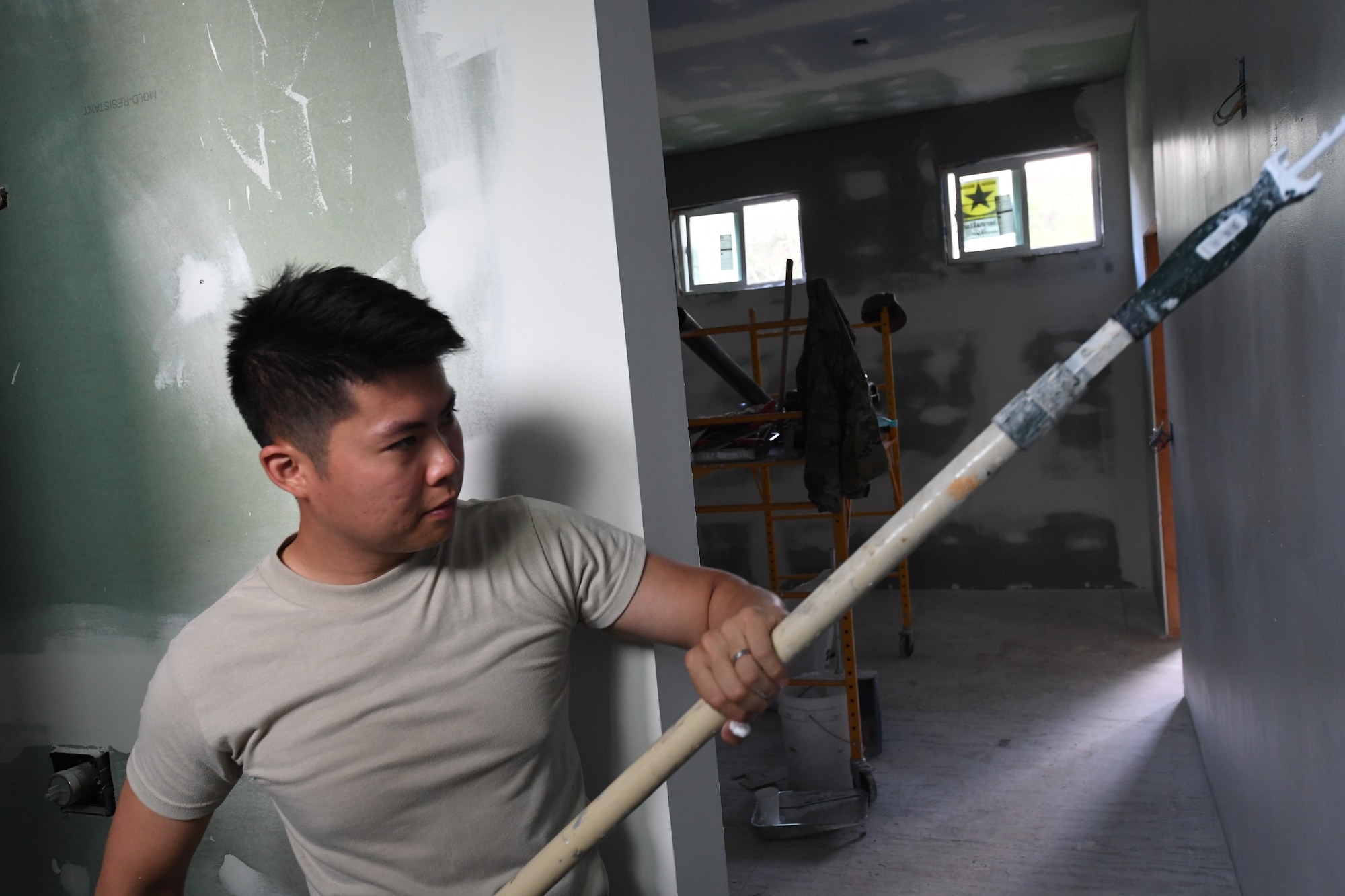 A photo of U.S. Air Force Staff Sgt. Siu Au, 624th Civil Engineer Squadron Operations Management Specialist, applying paint for facility repairs at Bellows Air Force Station, Hawaii, July 22, 2020, during the unit’s Annual Training. The U.S. Air Force Reserve’s 624th CES provided necessary repairs at Bellows AFS, a Military Welfare and Recreation facility that supports military families and communities, to improve infrastructure and increase individual readiness skills. (U.S. Air Force photo by Tech. Sgt. Garrett Cole)