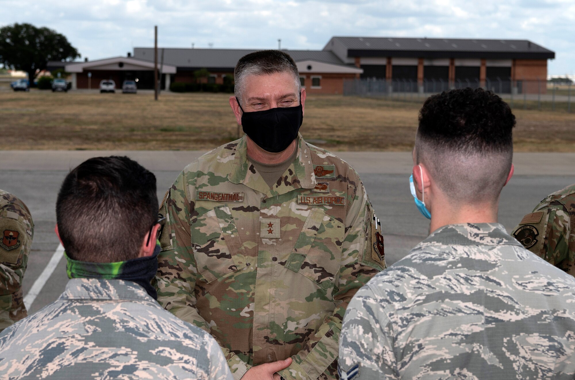 Maj. Gen. William Spangenthal, vice commander of Air Education and Training Command, elbow bumps Lt. Col. Damien Williams, 37th Training Group deputy commander, during an immersion tour June 24, 2020, at JBSA-Lackland, Texas.