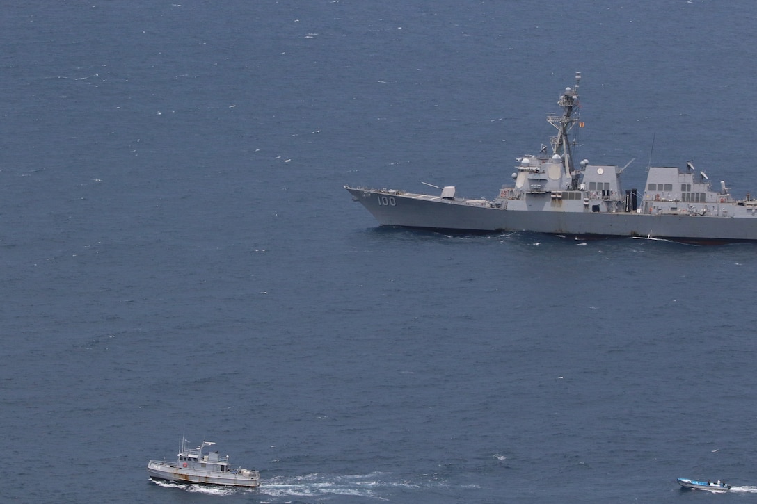 The Arleigh Burke-class guided-missile destroyer USS Kidd (DDG 100) participates in a passing exercise (PASSEX) with El Salvadoran Navy Maritime Patrol Vessel 13 (PM-13), July 29, 2020.