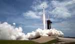 A SpaceX Falcon 9 rocket carrying NASA astronaut and retired Marine Corps Col. Douglas Hurley and fellow crew member Robert Behnken heads skyward during liftoff from Launch Complex 39A at NASA’s Kennedy Space Center, Florida, May 30, 2020. The mission marks the resumption of human space flight from the United States. Air National Guard members in Alaska and Hawaii provided support to the launch mission.