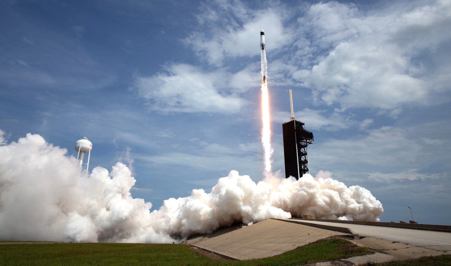 A SpaceX Falcon 9 rocket carrying NASA astronaut and retired Marine Corps Col. Douglas Hurley and fellow crew member Robert Behnken heads skyward during liftoff from Launch Complex 39A at NASA’s Kennedy Space Center, Florida, May 30, 2020. The mission marks the resumption of human space flight from the United States. Air National Guard members in Alaska and Hawaii provided support to the launch mission.