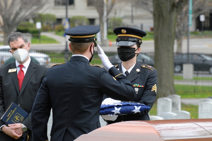 onor guard soldiers at a military funeral.